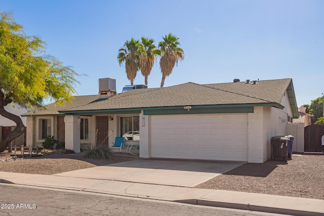 643 W Medina Ave, Mesa, AZ 85210 - ranch-style house featuring an attached garage, driveway, stucco siding, and a shingled roof