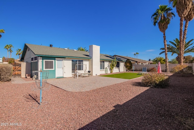 643 W Medina Ave, Mesa, AZ 85210 - back of property with a gate, a patio, and a chimney