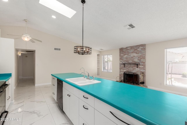 643 W Medina Ave, Mesa, AZ 85210 - kitchen with a sink, dishwasher, a fireplace, white cabinets, and vaulted ceiling