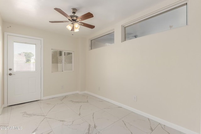 643 W Medina Ave, Mesa, AZ 85210 - entrance foyer featuring light marble finish floors, a ceiling fan, and baseboards