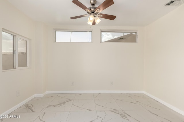 643 W Medina Ave, Mesa, AZ 85210 - unfurnished room featuring baseboards, light marble finish flooring, and a ceiling fan