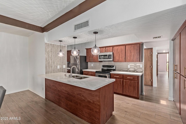 17346 E Oro Grande Dr, Fountain Hills, AZ 85268 - kitchen with light wood-type flooring, a sink, appliances with stainless steel finishes, and visible vents