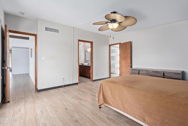 17346 E Oro Grande Dr, Fountain Hills, AZ 85268 - unfurnished bedroom with connected bathroom, light wood-style flooring, baseboards, visible vents, and ceiling fan