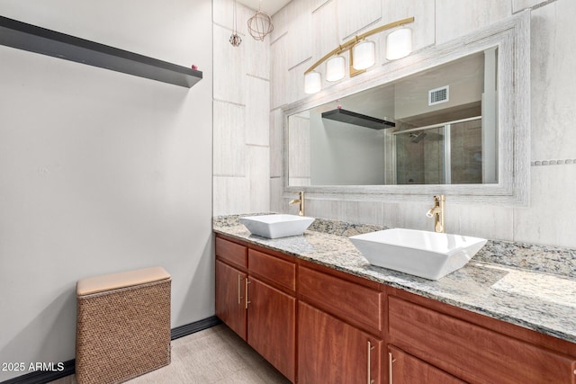 17346 E Oro Grande Dr, Fountain Hills, AZ 85268 - bathroom featuring double vanity, a sink, a stall shower, and visible vents