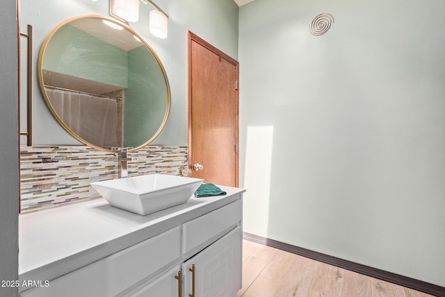 17346 E Oro Grande Dr, Fountain Hills, AZ 85268 - bathroom with vanity, tasteful backsplash, baseboards, and wood finished floors