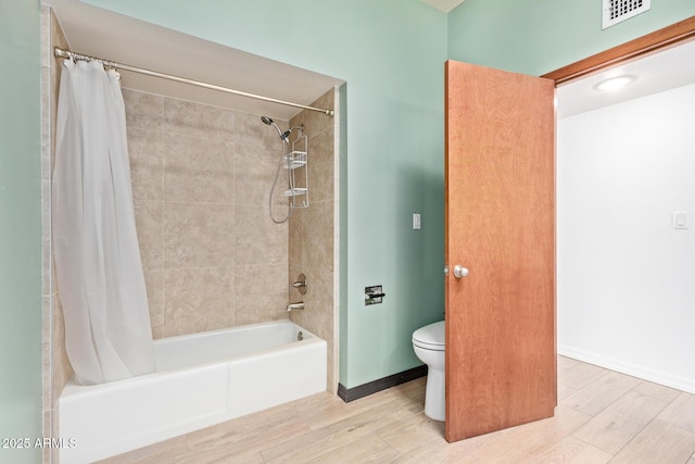 17346 E Oro Grande Dr, Fountain Hills, AZ 85268 - full bathroom with shower / bath combo, visible vents, baseboards, toilet, and wood finished floors