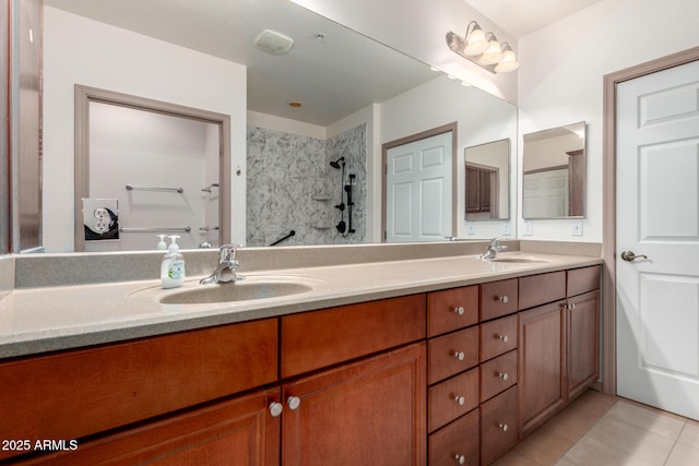 14575 W Mountain View Blvd Unit 12107, Surprise, AZ 85374 - bathroom featuring a sink, tiled shower, tile patterned floors, and double vanity