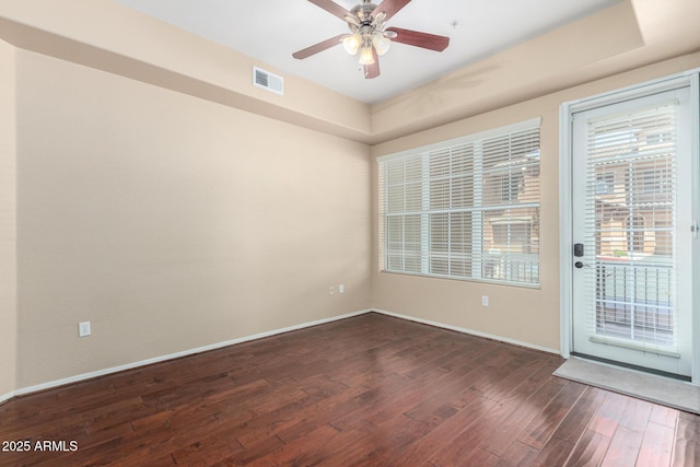 14575 W Mountain View Blvd Unit 12107, Surprise, AZ 85374 - unfurnished room featuring baseboards, a ceiling fan, dark wood-style flooring, and visible vents