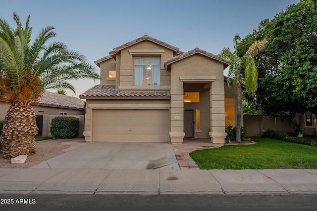 2421 W Indigo Dr, Chandler, AZ 85248 - view of front of house featuring an attached garage, concrete driveway, a tile roof, and stucco siding