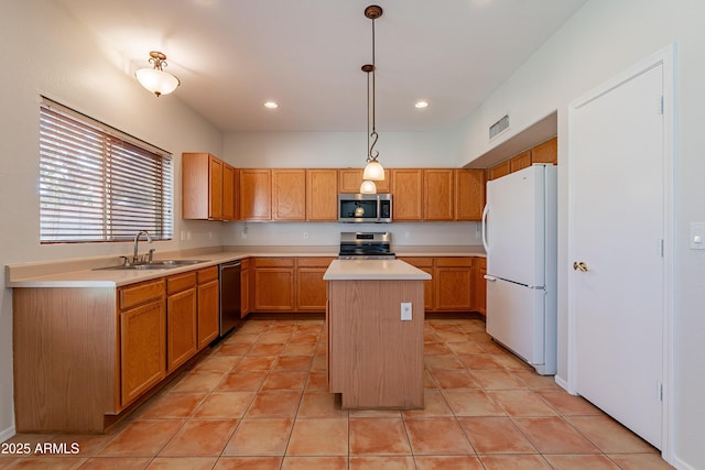 2421 W Indigo Dr, Chandler, AZ 85248 - kitchen with appliances with stainless steel finishes, a sink, light countertops, a center island, and light tile patterned floors