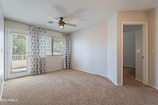 2421 W Indigo Dr, Chandler, AZ 85248 - spare room featuring carpet floors, ceiling fan, and baseboards