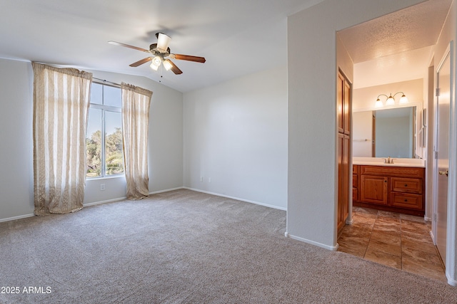2421 W Indigo Dr, Chandler, AZ 85248 - unfurnished room featuring light colored carpet, ceiling fan, baseboards, and a sink