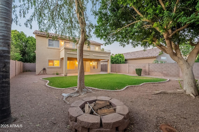 2421 W Indigo Dr, Chandler, AZ 85248 - back of house with stucco siding, a patio, a fire pit, and a tiled roof