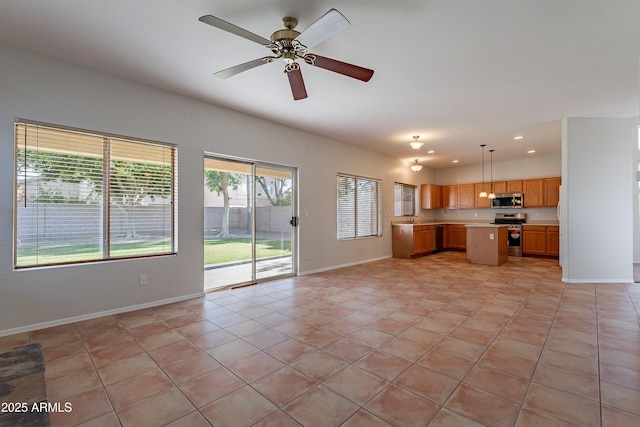 2421 W Indigo Dr, Chandler, AZ 85248 - unfurnished living room with baseboards, light tile patterned floors, a ceiling fan, recessed lighting, and a sink