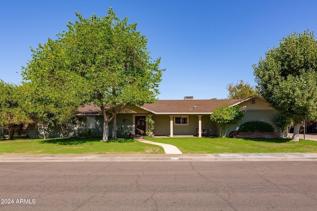 single story home with a front yard