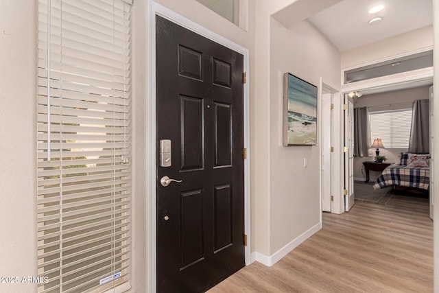 foyer entrance with light wood-type flooring