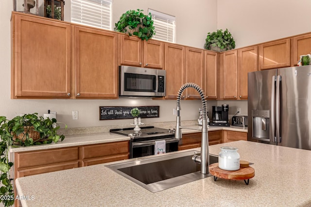 kitchen featuring appliances with stainless steel finishes and sink