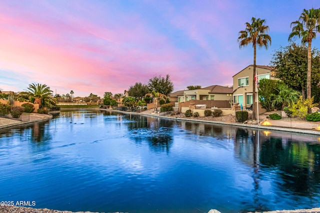 pool at dusk with a water view