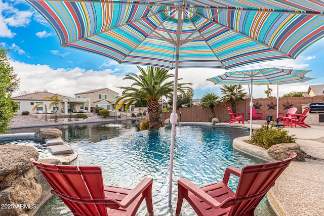 view of swimming pool with a patio area