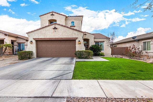 mediterranean / spanish-style home with a garage and a front lawn