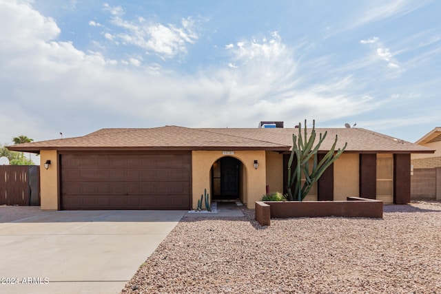 single story home with a garage