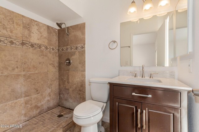 3837 W Dailey St, Phoenix, AZ 85053 - bathroom with vanity, toilet, and a tile shower