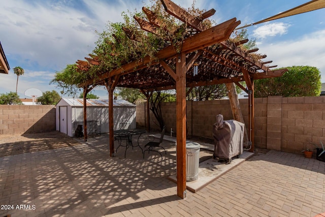 3837 W Dailey St, Phoenix, AZ 85053 - view of patio with a storage unit, a pergola, an outdoor structure, and a fenced backyard