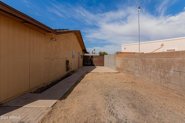 3837 W Dailey St, Phoenix, AZ 85053 - view of yard featuring driveway, fence, and a gate