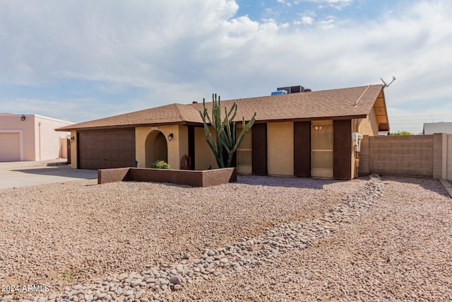 ranch-style house featuring a garage