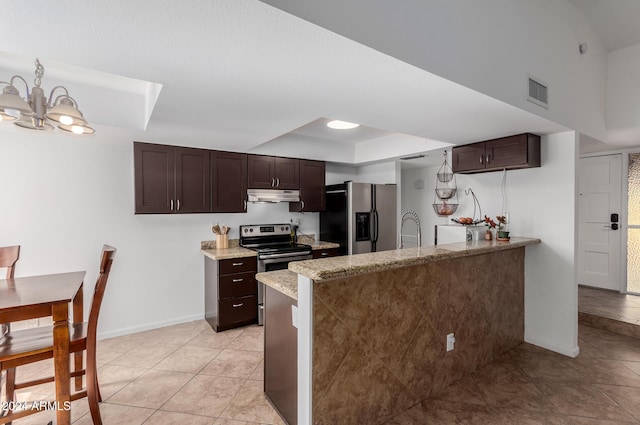 3837 W Dailey St, Phoenix, AZ 85053 - kitchen featuring under cabinet range hood, dark brown cabinetry, and appliances with stainless steel finishes