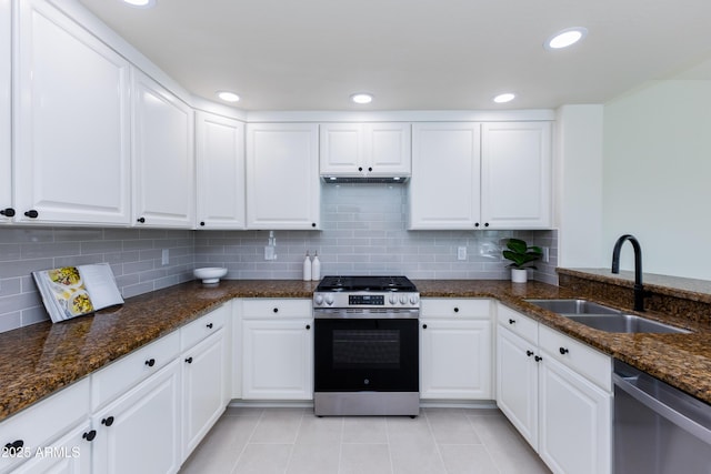 kitchen with sink, white cabinetry, and stainless steel appliances