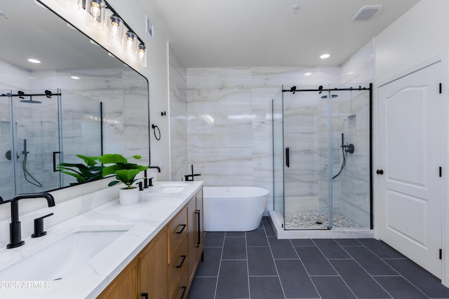 bathroom featuring tile patterned floors, vanity, and independent shower and bath