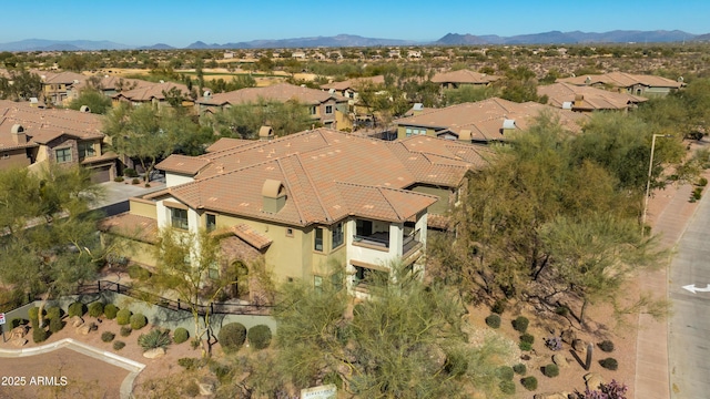 birds eye view of property featuring a mountain view