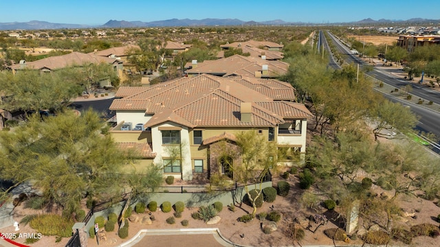 birds eye view of property featuring a mountain view