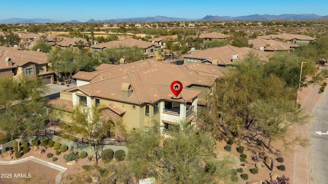 birds eye view of property featuring a mountain view