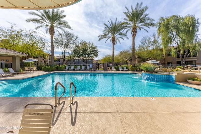 view of pool with a patio and pool water feature