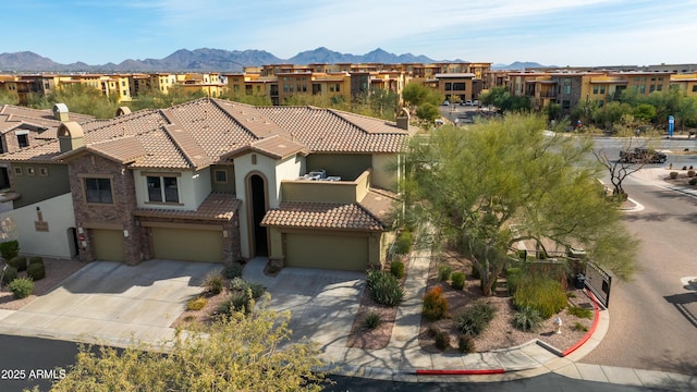 birds eye view of property with a mountain view