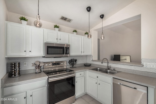 kitchen with white cabinets, stainless steel appliances, and sink