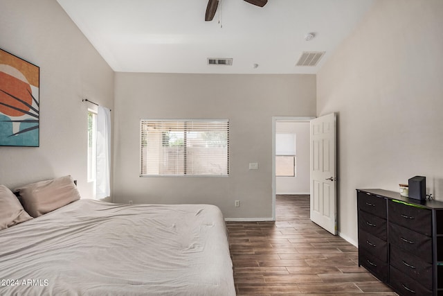 bedroom with ceiling fan and dark wood-type flooring