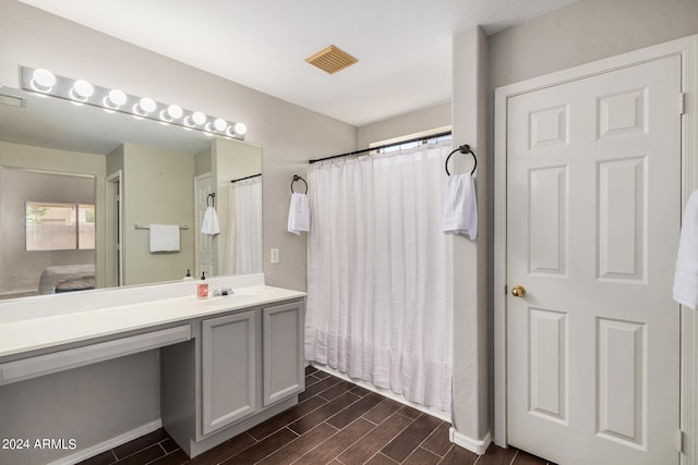 bathroom with a shower with curtain and vanity