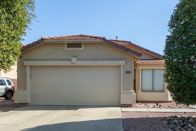 view of front of property with a garage