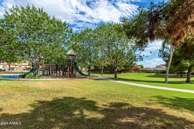 exterior space featuring a lawn and a playground