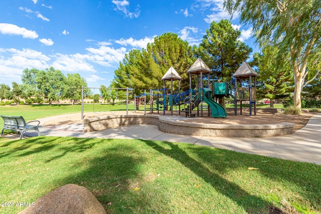 view of playground with a lawn