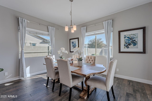 dining room featuring dark hardwood / wood-style floors and a chandelier