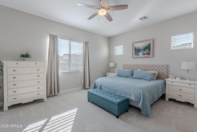 bedroom with light colored carpet and ceiling fan