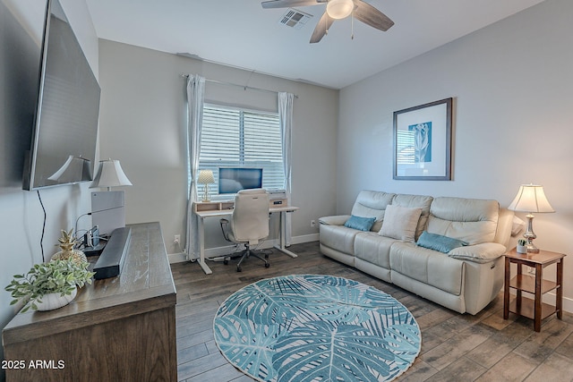 office with dark wood-type flooring and ceiling fan