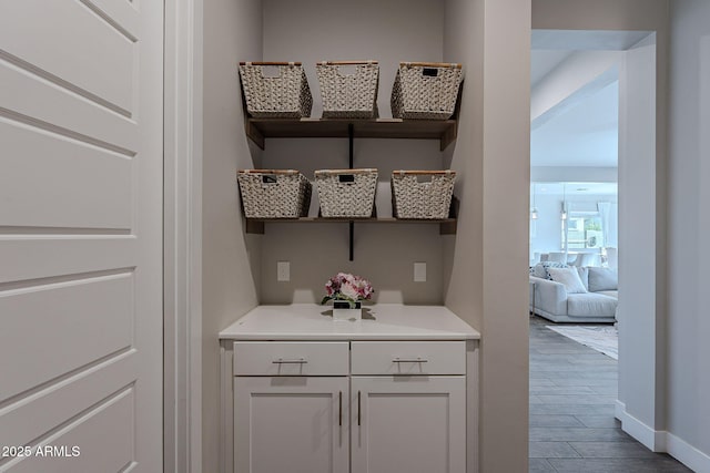 bar with white cabinetry