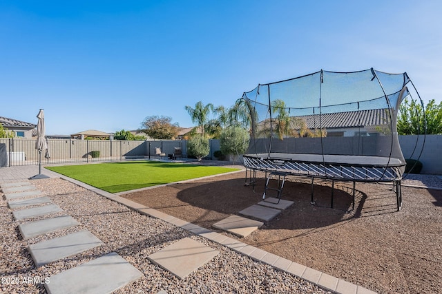 view of yard with a trampoline