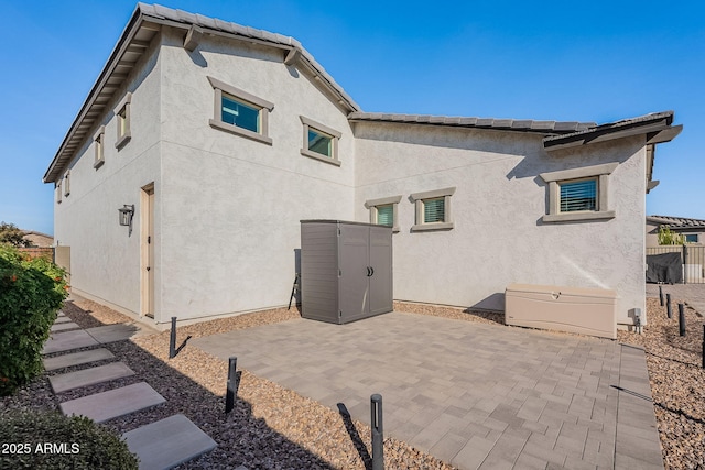 back of property featuring a patio area