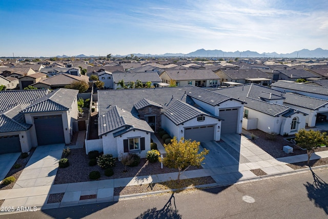 birds eye view of property featuring a mountain view